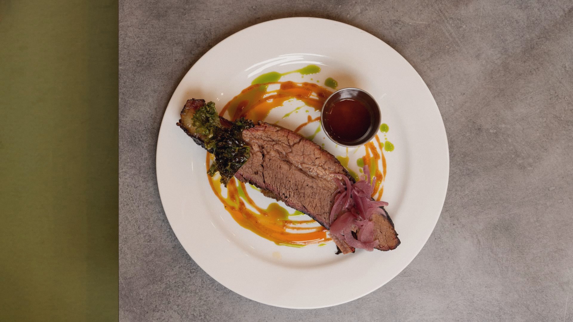 Hickory smoked brisket with pickled onions and house sauce
