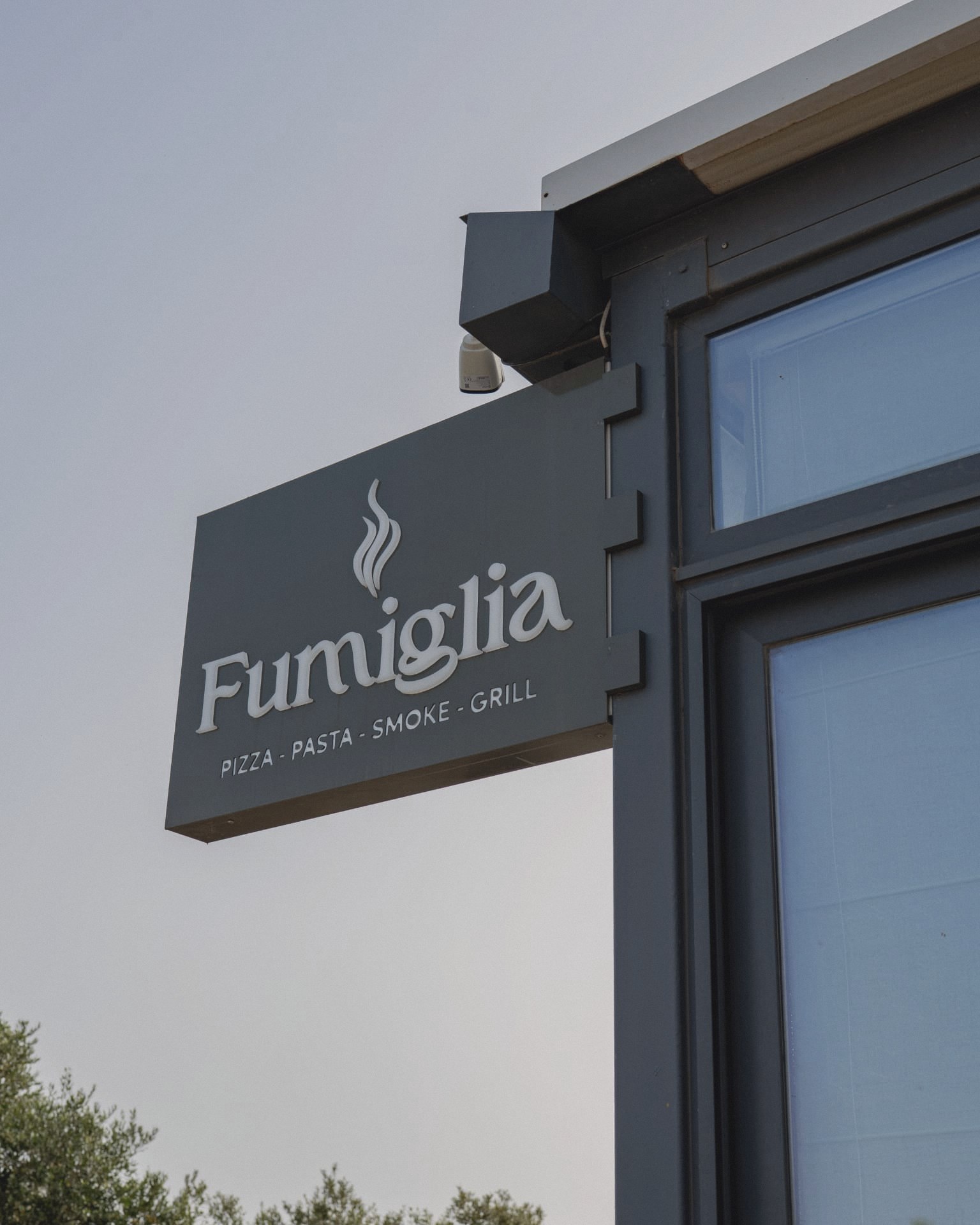 The Fumiglia sign outside the restaurant in Qala, Gozo
